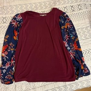 Ladies long sleeve knit top with floral print sleeves,